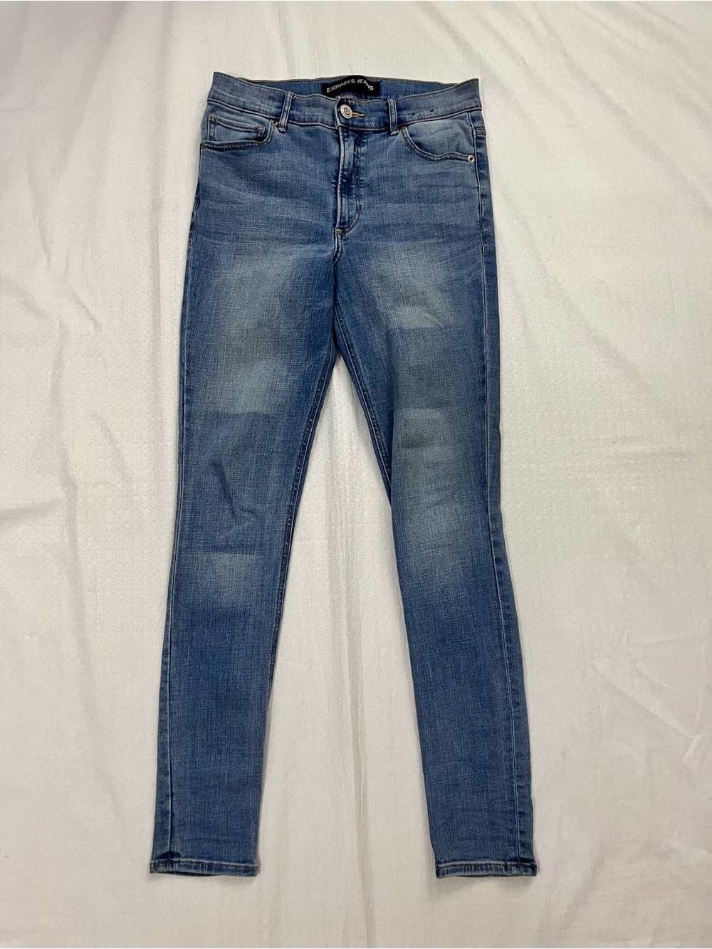 Express Women’s Skinny Jeans in Medium Blue Wash size 4